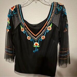 Nique Black Blouse with Vibrant Embroidery and Sheer Sleeves